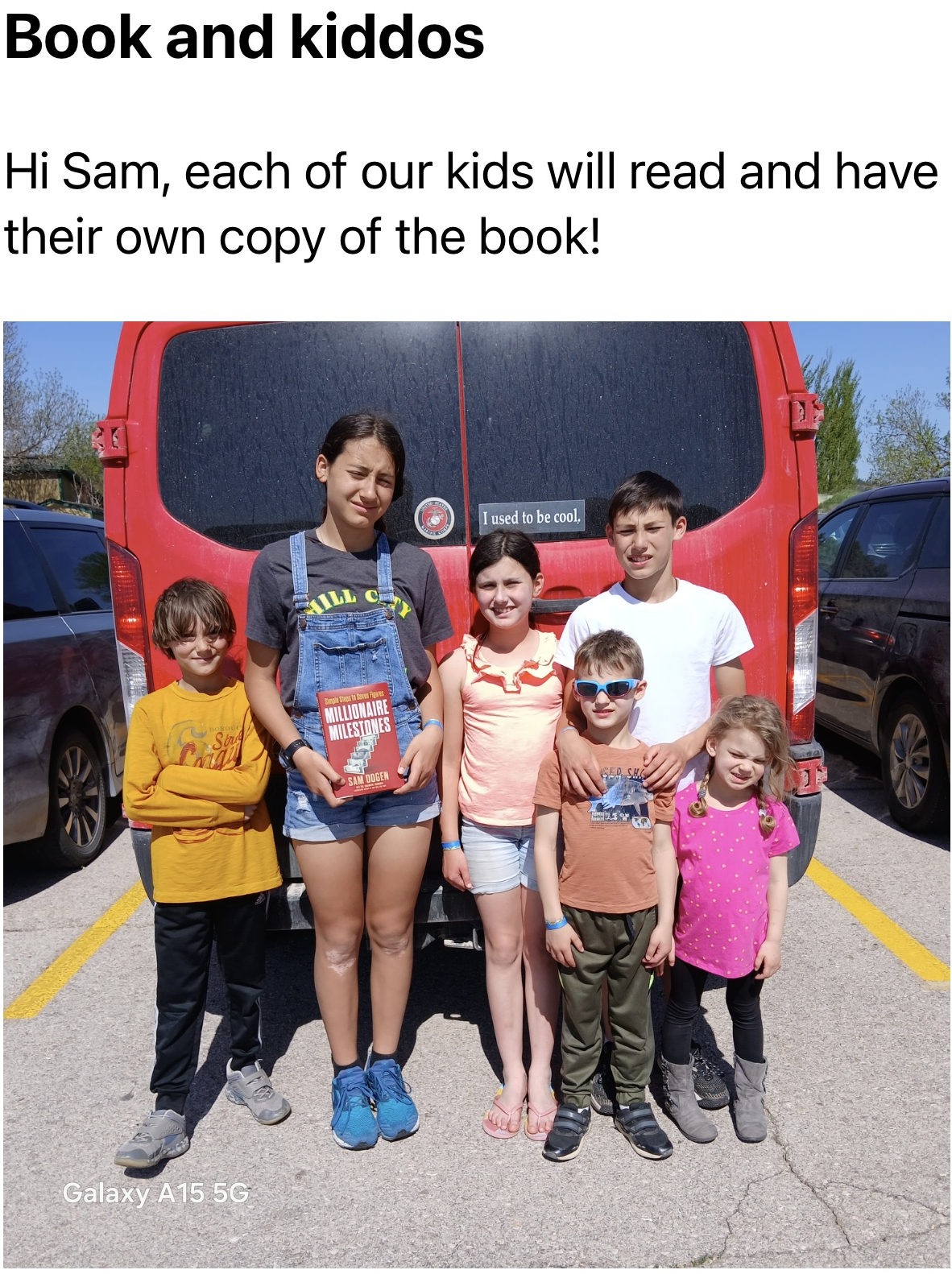Middle-class multi-millionaires - Luis and his children with Millionaire Milestones book