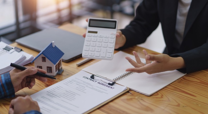 Two investors comparing investments.