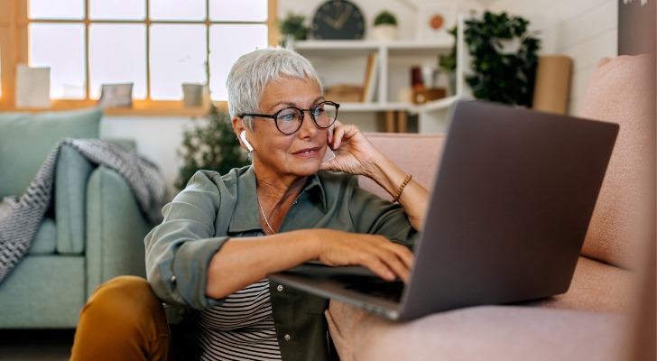 A senior discussing retirement account options with an advisor in a video chat.
