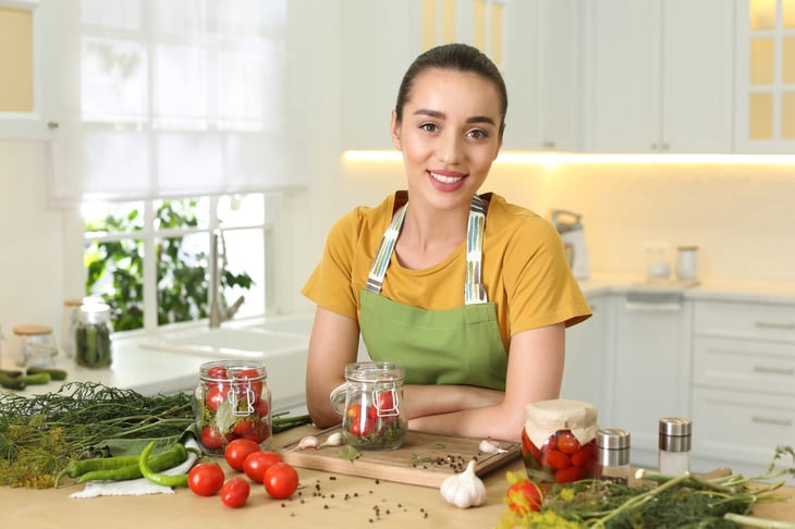 woman canning pickling and preserving foods